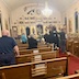 View from the back of the church, with people back in their pews, as the Epitaphios is carried back towards the front of the church.