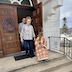 Another photo of the procession leaving the church. The young altarboy in the previous photo is now walking down the steps of the church, with the woman behind him, and two men visible behind her.